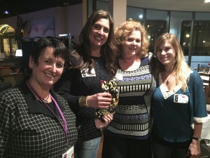 Shared Adventures receives checks from 100 Women Who Care